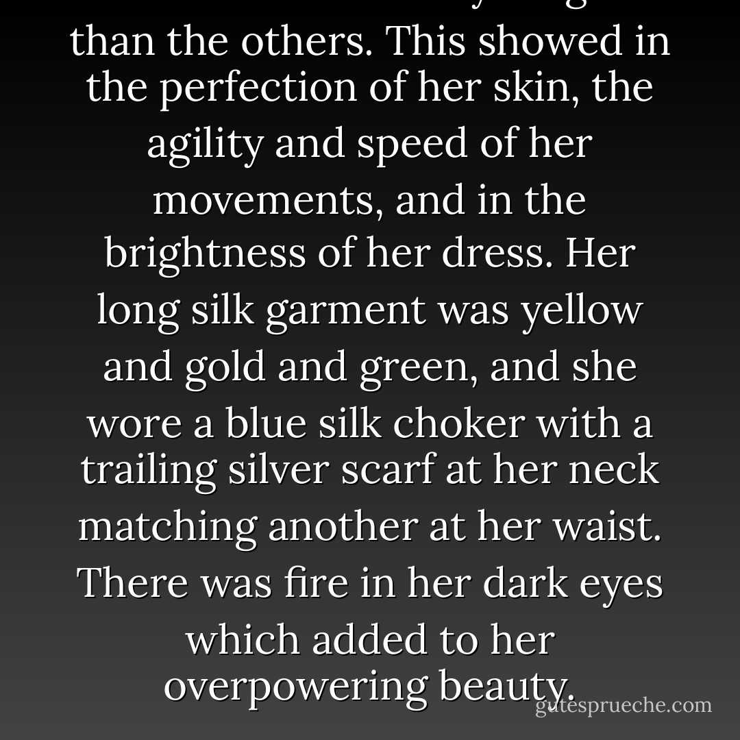 The fourth elf was younger than the others. This showed in the perfection of her skin, the agility and speed of her movements, and in the brightness of her dress. Her long silk garment was yellow and gold and green, and she wore a blue silk choker with a trailing silver scarf at her neck matching another at her waist. There was fire in her dark eyes which added to her overpowering beauty. - Ian Livingstone